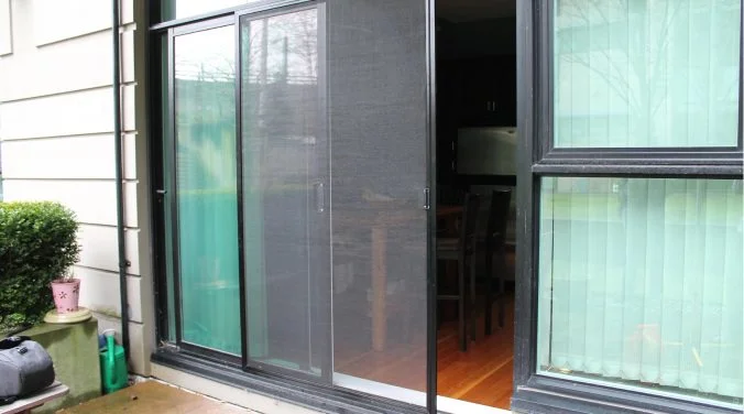 A sliding patio screen door