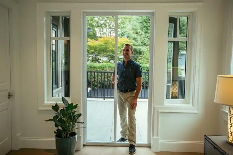 guy walking through a wizard retractable screen door