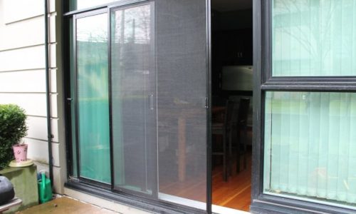 A sliding patio screen door